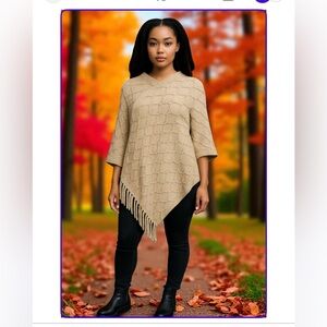White Mark tan fall poncho with partial fringe bottom .